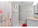 Bathroom featuring decorative floral shower curtain, neutral paint, and tile flooring at 138 Ardmore Pl, Mooresville, NC 28117