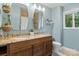 Bathroom featuring double sinks, granite countertop, wood cabinets, and neutral paint at 138 Ardmore Pl, Mooresville, NC 28117