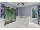 Bedroom with a daybed, a sliding door to the deck, and a window with backyard views at 138 Ardmore Pl, Mooresville, NC 28117
