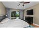 Bedroom featuring light-colored walls, a ceiling fan, and access to an outdoor balcony at 138 Ardmore Pl, Mooresville, NC 28117