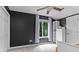 Bedroom features a ceiling fan, neutral carpet, dark-colored walls, and a closet at 138 Ardmore Pl, Mooresville, NC 28117