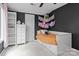 Bedroom features dark-colored walls, a ceiling fan, a built-in shelf and a closet at 138 Ardmore Pl, Mooresville, NC 28117