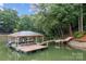 Picture of boat dock featuring a covered area, boat lift, and the serene waterfront view at 138 Ardmore Pl, Mooresville, NC 28117