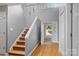 Bright foyer with hardwood floors, a staircase, and a view to the entrance at 138 Ardmore Pl, Mooresville, NC 28117