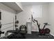 Home gym area featuring weights, exercise bike, weight bench, and tile flooring at 138 Ardmore Pl, Mooresville, NC 28117