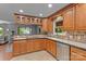 An open concept kitchen featuring tile backsplash, stainless steel appliances, and ample counter space at 138 Ardmore Pl, Mooresville, NC 28117