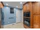 This kitchen has updated appliances, tile flooring and a great deal of storage in cabinets at 138 Ardmore Pl, Mooresville, NC 28117