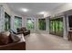 Bright and airy living room with oversized windows and sliding glass doors to the outside deck at 138 Ardmore Pl, Mooresville, NC 28117