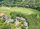 Aerial view of homes situated along a golf course and lush trees at 14746 Greenpoint Ln, Huntersville, NC 28078