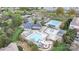 Aerial view of the community amenities including a clubhouse, tennis courts, and two swimming pools at 14746 Greenpoint Ln, Huntersville, NC 28078