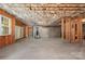 Unfinished basement with exposed framing and a window, offering potential for customization at 14746 Greenpoint Ln, Huntersville, NC 28078