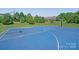 Outdoor community basketball court with two hoops on a blue surface at 14746 Greenpoint Ln, Huntersville, NC 28078