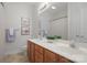 Bathroom featuring a double vanity with ample countertop space and modern fixtures at 14746 Greenpoint Ln, Huntersville, NC 28078