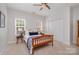 Well-lit bedroom with neutral carpet, a ceiling fan, and a closet with white doors at 14746 Greenpoint Ln, Huntersville, NC 28078