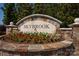 Stone monument sign for Skybrook community with manicured landscaping and flower beds at 14746 Greenpoint Ln, Huntersville, NC 28078