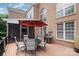 Outdoor deck with dining table, grill, and umbrella, perfect for entertaining at 14746 Greenpoint Ln, Huntersville, NC 28078