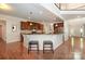Modern kitchen with dark wood cabinets, stainless steel appliances, and hardwood floors at 14746 Greenpoint Ln, Huntersville, NC 28078