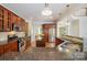 Modern kitchen featuring granite counters, stainless steel appliances, dark cabinets and hardwood floors at 14746 Greenpoint Ln, Huntersville, NC 28078