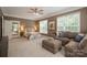 Large main bedroom with plush seating area, carpeting, and large windows providing lots of light at 14746 Greenpoint Ln, Huntersville, NC 28078