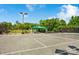 Community tennis court with a covered gazebo and well-maintained green surroundings at 14746 Greenpoint Ln, Huntersville, NC 28078