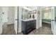 Modern bathroom vanity with sleek gray cabinetry, white countertop, and decorative fixtures, blending style with functionality at 1543 Withers Dr, Denver, NC 28037