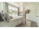 Comfortable bedroom with a large window, closet, and neutral decor create a relaxing space at 1543 Withers Dr, Denver, NC 28037