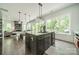 Beautiful kitchen island with stainless steel appliances, natural light and hardwood floors at 1543 Withers Dr, Denver, NC 28037