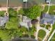 Overhead shot of sprawling lakeside home with lush landscaping and circular driveway at 173 Riverwood Rd, Mooresville, NC 28117