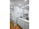 Bathroom featuring double sinks, granite countertops, white cabinets, and a shower/tub combination at 173 Riverwood Rd, Mooresville, NC 28117