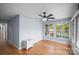 Bright bedroom features hardwood floors and large windows that offer scenic outdoor views at 173 Riverwood Rd, Mooresville, NC 28117