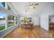 Dining room with hardwood floors, chandelier, and lake views from many windows at 173 Riverwood Rd, Mooresville, NC 28117