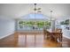 Dining room with hardwood floors, lake view, and a wooden dining table with six chairs at 173 Riverwood Rd, Mooresville, NC 28117