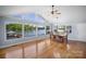 Bright dining room featuring waterfront views and hardwood floors at 173 Riverwood Rd, Mooresville, NC 28117