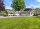 Home exterior features a lush lawn and gravel driveway at 173 Riverwood Rd, Mooresville, NC 28117