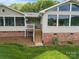 Charming home entrance with a welcoming porch and well-maintained landscaping at 173 Riverwood Rd, Mooresville, NC 28117