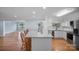 Modern kitchen featuring stainless steel appliances, and an eat-in island with granite countertop at 173 Riverwood Rd, Mooresville, NC 28117