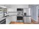 Modern kitchen features stainless steel appliances, granite counters, and ample storage space at 173 Riverwood Rd, Mooresville, NC 28117