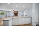 Kitchen area featuring stainless appliances, eat-in island, open layout, and hardwood floors at 173 Riverwood Rd, Mooresville, NC 28117