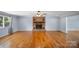 Spacious living room with hardwood floors and brick fireplace, perfect for entertaining at 173 Riverwood Rd, Mooresville, NC 28117
