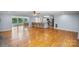 Open floor plan featuring wood floors, a living room, and eat-in kitchen at 173 Riverwood Rd, Mooresville, NC 28117