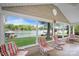 Inviting sunroom with views of the lake and comfortable seating arrangement at 173 Riverwood Rd, Mooresville, NC 28117