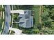 A bird's eye view of a home with a large roof, driveway, and well-kept lawn at 1908 Masons Bend Dr, Fort Mill, SC 29708