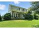 Expansive backyard with a covered patio and mature landscaping at 1908 Masons Bend Dr, Fort Mill, SC 29708