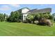 Spacious backyard featuring a manicured lawn and mature plantings at 1908 Masons Bend Dr, Fort Mill, SC 29708