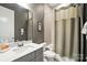 Bathroom featuring a vanity with gray cabinets, shower with curtains, and neutral tones at 1908 Masons Bend Dr, Fort Mill, SC 29708