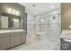 Bright bathroom features dual shower heads, frameless shower, built-in bench and windows at 1908 Masons Bend Dr, Fort Mill, SC 29708