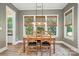 Bright dining room featuring a wooden table set, large windows, and natural light at 1908 Masons Bend Dr, Fort Mill, SC 29708