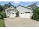 Attached two-car garage with ample parking space and traditional curb appeal at 1908 Masons Bend Dr, Fort Mill, SC 29708