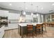 Modern kitchen featuring a large island, stainless steel appliances, and white cabinetry at 1908 Masons Bend Dr, Fort Mill, SC 29708