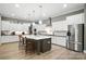 Bright kitchen featuring a large island, modern stainless steel appliances, and ample counter space at 1908 Masons Bend Dr, Fort Mill, SC 29708